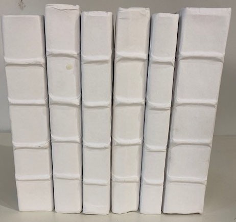 A Set Of Six Decorative White Books