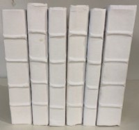 A Set Of Six Decorative White Books